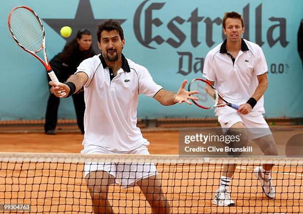 Daniel Nestor of Canada and Nenad Zimonjic of Serbia in action against Lukasz Kubot of Poland and Oliver Marach of Austria in their quarter final...