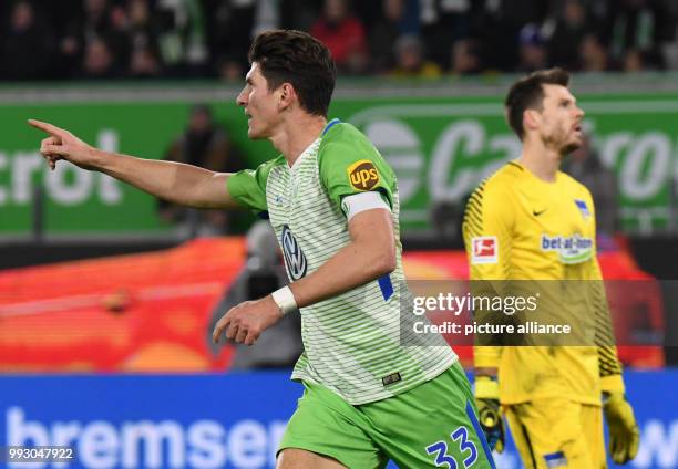 Wolfsburg's Mario Gomez celebrates his 2:1 goal against Berlin next to Hertha's goalkeeper Rune Jarstein during the German Bundesliga soccer match...