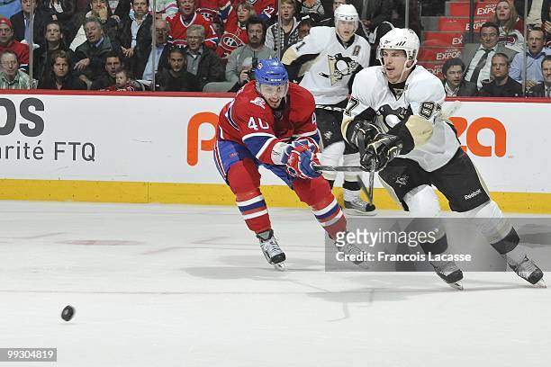 Sidney Crosby of the Pittsburgh Penguins battles for the puck with Maxim Lapierre of Montreal Canadiens in Game Six of the Eastern Conference...
