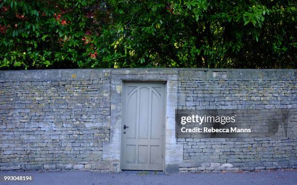 secret garden - garden wall stock pictures, royalty-free photos & images