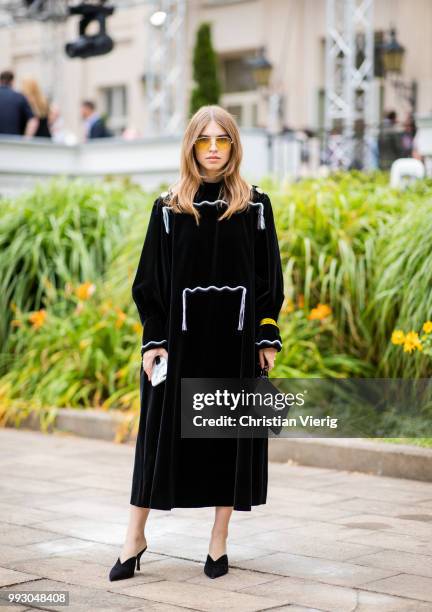 Swantje Soemmer wearing black dress, bag with print pouch seen outside Der Berliner Salon during the Berlin Fashion Week July 2018 on July 6, 2018 in...