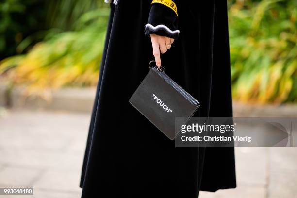 Swantje Soemmer wearing black dress, bag with print pouch seen outside Der Berliner Salon during the Berlin Fashion Week July 2018 on July 6, 2018 in...