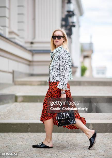 Sonia Lyson wearing Topshop jacket, top and skirt with animal print, Valentino bag seen during the Berlin Fashion Week July 2018 on July 6, 2018 in...