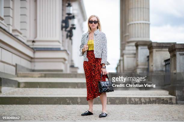 Sonia Lyson wearing Topshop jacket, top and skirt with animal print, Valentino bag seen during the Berlin Fashion Week July 2018 on July 6, 2018 in...