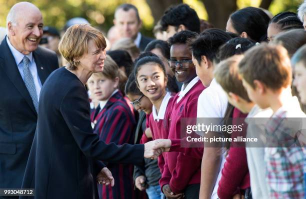 German federal president Frank-Walter Steinmeier and the General Governor's husband David Gascoigne greet a group of kids in Wellington, New Zealand,...