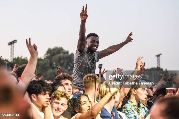 Festival goers enjoy the atmosphere from the crowd of the Main Stage on Day 1 of Wireless Festival 2018 at Finsbury Park on July 6, 2018 in London,...