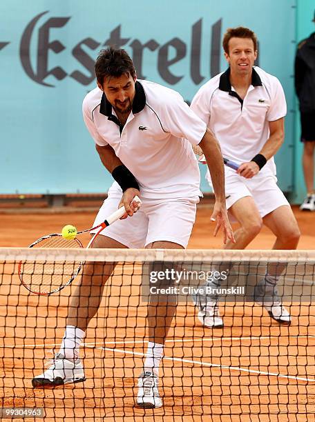 Daniel Nestor of Canada and Nenad Zimonjic of Serbia in action against Lukasz Kubot of Poland and Oliver Marach of Austria in their quarter final...