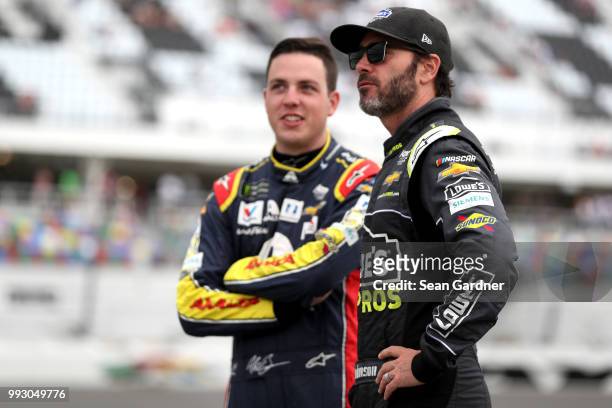 Alex Bowman, driver of the Axalta Chevrolet, and Jimmie Johnson, driver of the Lowe's for Pros Chevrolet, talk during qualifying for the Monster...