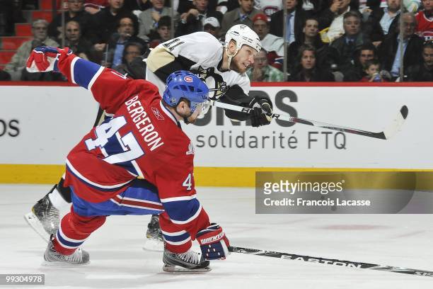 Jordan Staal of the Pittsburgh Penguins takes a shot in front of Marc-Andre Bergeron of Montreal Canadiens in Game Six of the Eastern Conference...