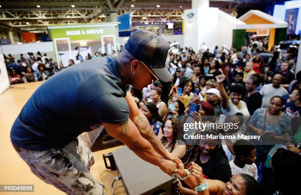 Singer NE-YO greats the crowd during the SiriusXM's Heart & Soul Channel Broadcasts from Essence Festival on July 6, 2018 in New Orleans, Louisiana.