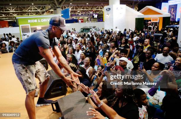 Singer NE-YO greats the crowd during the SiriusXM's Heart & Soul Channel Broadcasts from Essence Festival on July 6, 2018 in New Orleans, Louisiana.