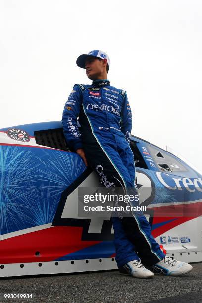 Kyle Larson, driver of the Credit One Bank Chevrolet, waits by his car during qualifying for the Monster Energy NASCAR Cup Series Coke Zero Sugar 400...