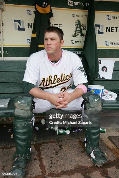 Landon Powell of the Oakland Athletics sitting in the dugout prior to the game against the Tampa Bay Rays at the Oakland Coliseum on May 9, 2010 in...