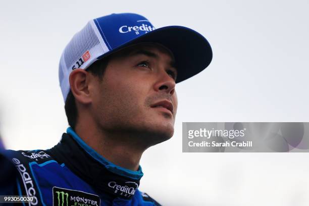 Kyle Larson, driver of the Credit One Bank Chevrolet, waits by his car during qualifying for the Monster Energy NASCAR Cup Series Coke Zero Sugar 400...