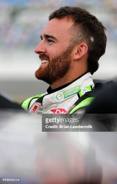 Austin Dillon, driver of the American Ethanol e15 Chevrolet, stands by his car during qualifying for the Monster Energy NASCAR Cup Series Coke Zero...