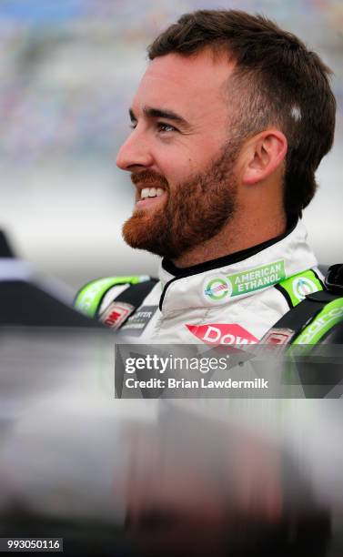 Austin Dillon, driver of the American Ethanol e15 Chevrolet, stands by his car during qualifying for the Monster Energy NASCAR Cup Series Coke Zero...