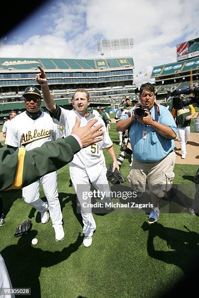 Dallas Braden of the Oakland Athletics celebrating after pitching a perfect game against the Tampa Bay Rays at the Oakland Coliseum on May 9, 2010 in...