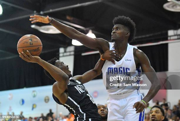 Jonathan Isaac of the Orlando Magic contests a shot from Semaj Christon of the Brooklyn Nets during the 2018 NBA Summer League at the Cox Pavilion on...