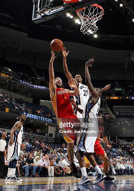 Luis Scola of the Houston Rockets puts a shot up against Rudy Gay of the Memphis Grizzlies during the game at the FedExForum on April 6, 2010 in...