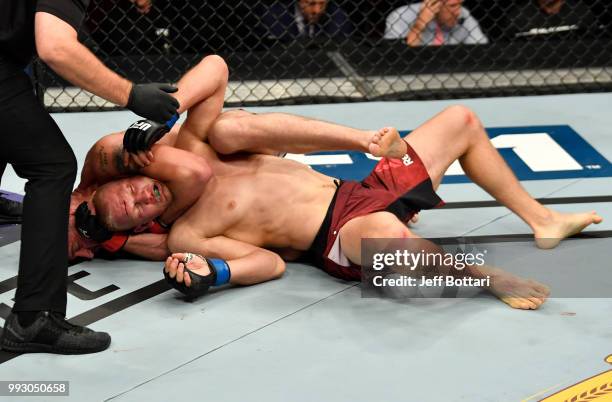 Gerald Meerschaert secures a rear choke submission against Oskar Piechota of Poland in their middleweight bout during The Ultimate Fighter Finale...