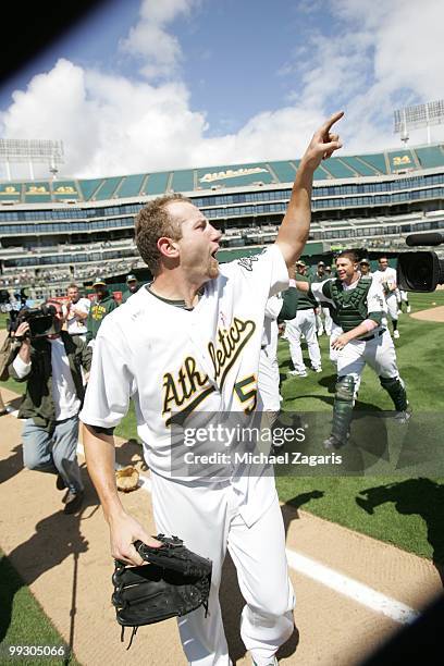 Dallas Braden of the Oakland Athletics celebrating after pitching a perfect game against the Tampa Bay Rays at the Oakland Coliseum on May 9, 2010 in...