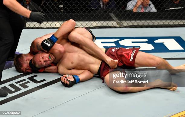 Gerald Meerschaert secures a rear choke submission against Oskar Piechota of Poland in their middleweight bout during The Ultimate Fighter Finale...