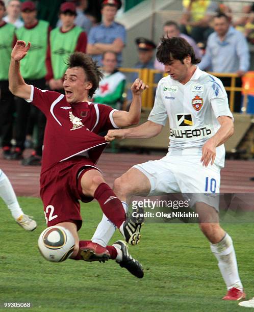 Andrei Gorbanets of FC Rubin Kazan battles for the ball with Alan Dzagoev of PFC CSKA Moscow in action during the Russian Football League...
