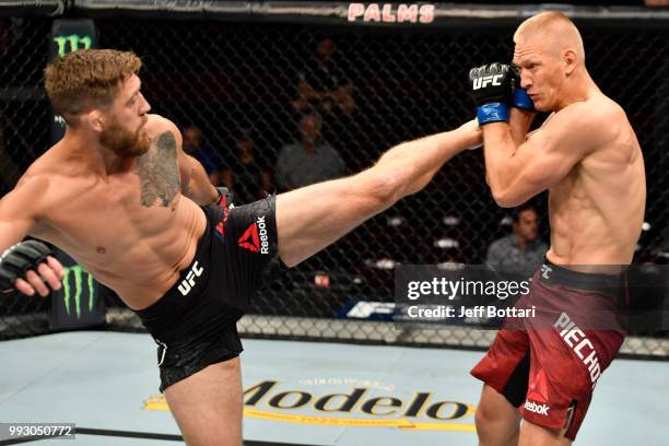 Gerald Meerschaert kicks Oskar Piechota of Poland in their middleweight bout during The Ultimate Fighter Finale event inside The Pearl concert...