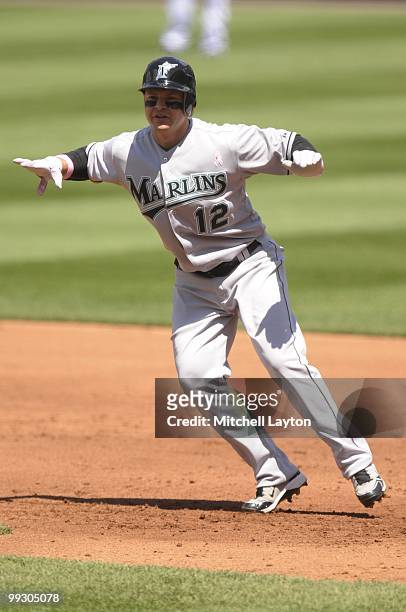 Cody Ross of the Florida Marlins leads off first base during a baseball game against the Washington Nationals on May 9, 2010 at Nationals Park in...