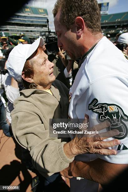 Dallas Braden of the Oakland Athletics celebrating with his grandmother Peggy Lindsey after pitching a perfect game against the Tampa Bay Rays at the...