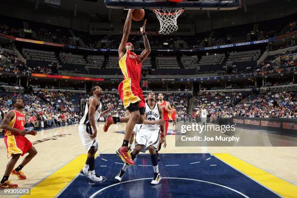 Trevor Ariza of the Houston Rockets puts a shot up against Rudy Gay of the Memphis Grizzlies during the game at the FedExForum on April 6, 2010 in...