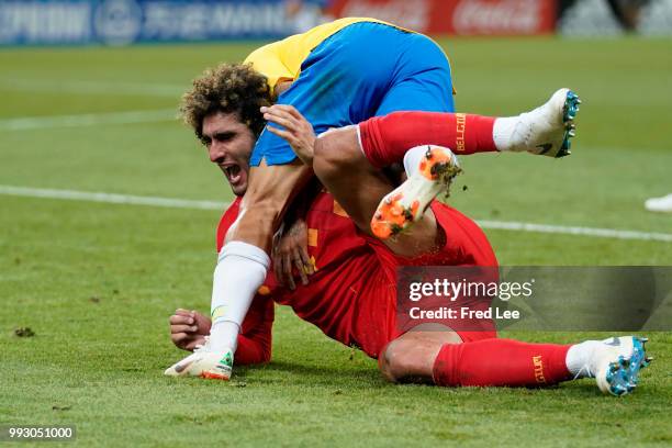 Marouane Fellaini of Belgium and Philippe Coutinho of Brazil battle for the ball during the 2018 FIFA World Cup Russia Quarter Final match between...