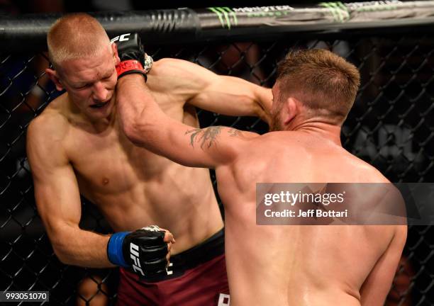 Gerald Meerschaert and Oskar Piechota of Poland trade punches in their middleweight bout during The Ultimate Fighter Finale event inside The Pearl...