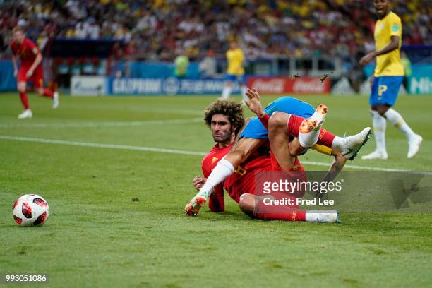 Marouane Fellaini of Belgium and Philippe Coutinho of Brazil battle for the ball during the 2018 FIFA World Cup Russia Quarter Final match between...