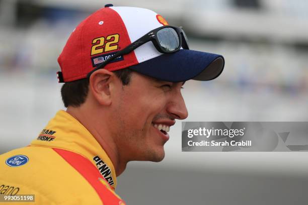 Joey Logano, driver of the Shell Pennzoil Ford, walks to his car during qualifying for the Monster Energy NASCAR Cup Series Coke Zero Sugar 400 at...