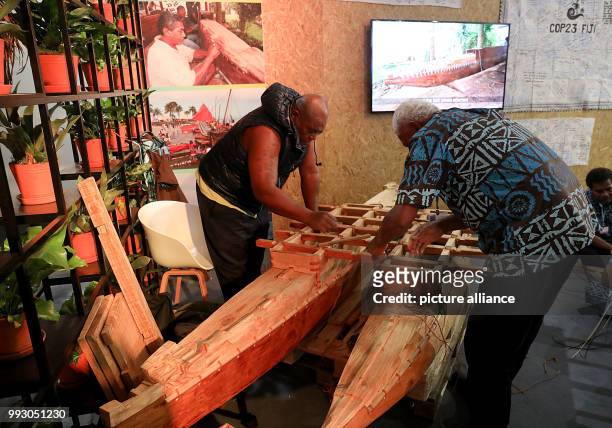 Representatives of the Fiji Islands build a Drua canoe at the World Climate Conference in Bonn, Germany, 6 November 2017. The World Climate...