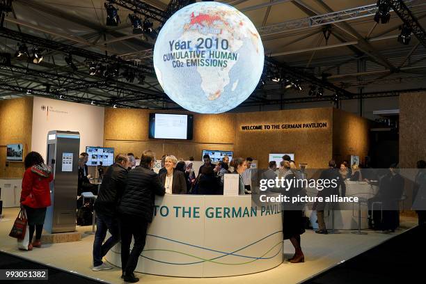 Globe can be seen illuminated inside the German pavilion at the UN World Climate Change Conference COP23 in Bonn, Germany, 06 November 2017. The...