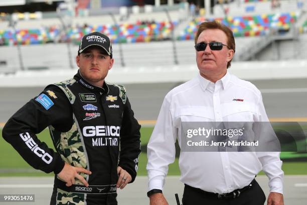 Ty Dillon, driver of the GEICO Military Chevrolet, talks with team owner, Richard Childress, during qualifying for the Monster Energy NASCAR Cup...