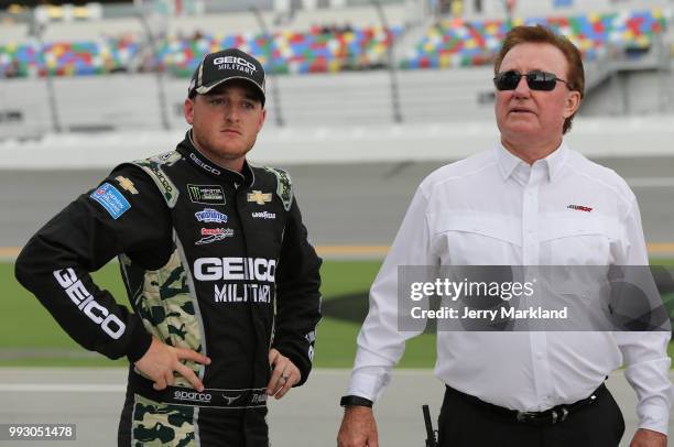 Ty Dillon, driver of the GEICO Military Chevrolet, talks with team owner, Richard Childress, during qualifying for the Monster Energy NASCAR Cup...