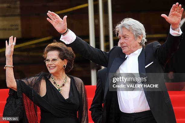 Italian actress Claudia Cardinale ans French actor Alain Delon arrive for the screening of "Il Gattopardpo" presented during a special screening at...