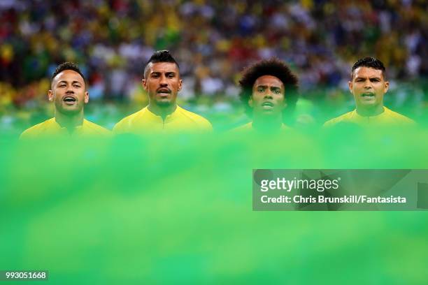 Neymar, Paulinho, Willian and Thiago Silva of Brazil sing the national anthem ahead of the 2018 FIFA World Cup Russia Quarter Final match between...