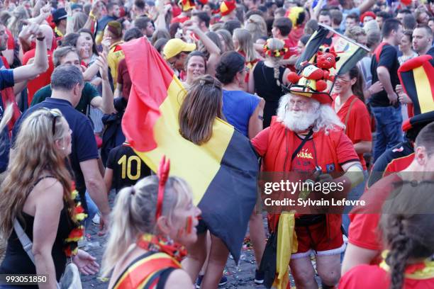 Belgian soccer fans dance to celebrate winning of Belgium National team "Les Diables Rouges" during FIFA WC 2018 Belgium vs Brasil at Tournai Fan...