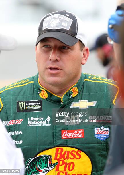 Ryan Newman, driver of the Bass Pro Shops/Cabela's Chevrolet, stands by his car during qualifying for the Monster Energy NASCAR Cup Series Coke Zero...