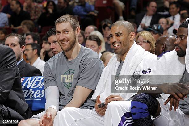 Andres Nocioni and Ime Udoka of the Sacramento Kings share a laugh on the bench during the game against the Los Angeles Clippers at Arco Arena on...