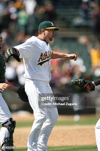 Dallas Braden of the Oakland Athletics celebrating after pitching a perfect game against the Tampa Bay Rays at the Oakland Coliseum on May 9, 2010 in...