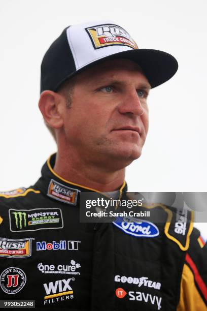 Clint Bowyer, driver of the Rush Truck Centers Ford, stands by his car during qualifying for the Monster Energy NASCAR Cup Series Coke Zero Sugar 400...