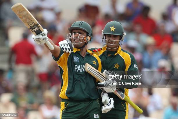 Kamran Akmal of Pakistan celebrates his half century with Salman Butt during the ICC World Twenty20 semi final between Australia and Pakistan at the...