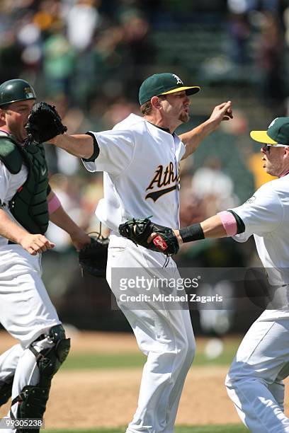Dallas Braden of the Oakland Athletics celebrating after pitching a perfect game against the Tampa Bay Rays at the Oakland Coliseum on May 9, 2010 in...