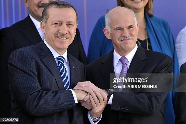 Greek Prime Minister George Papandreou and his Turkish counterpart Recep Tayyip Erdogan shake hands in Athens on May 14, 2010. Turkey's Prime...