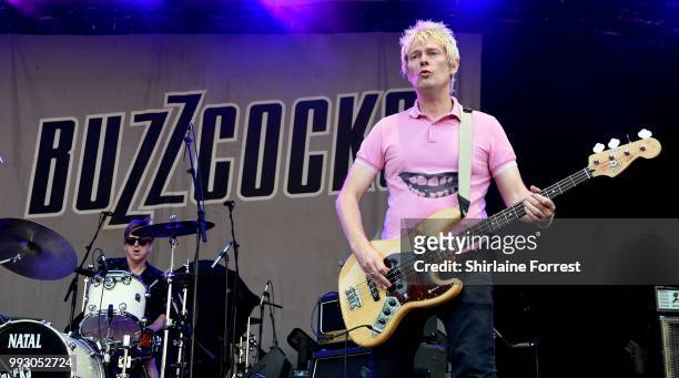 Danny Farrant and Chris Remmington of Buzzcocks perform during Sounds of the City at Castlefield Bowl on July 6, 2018 in Manchester, England.